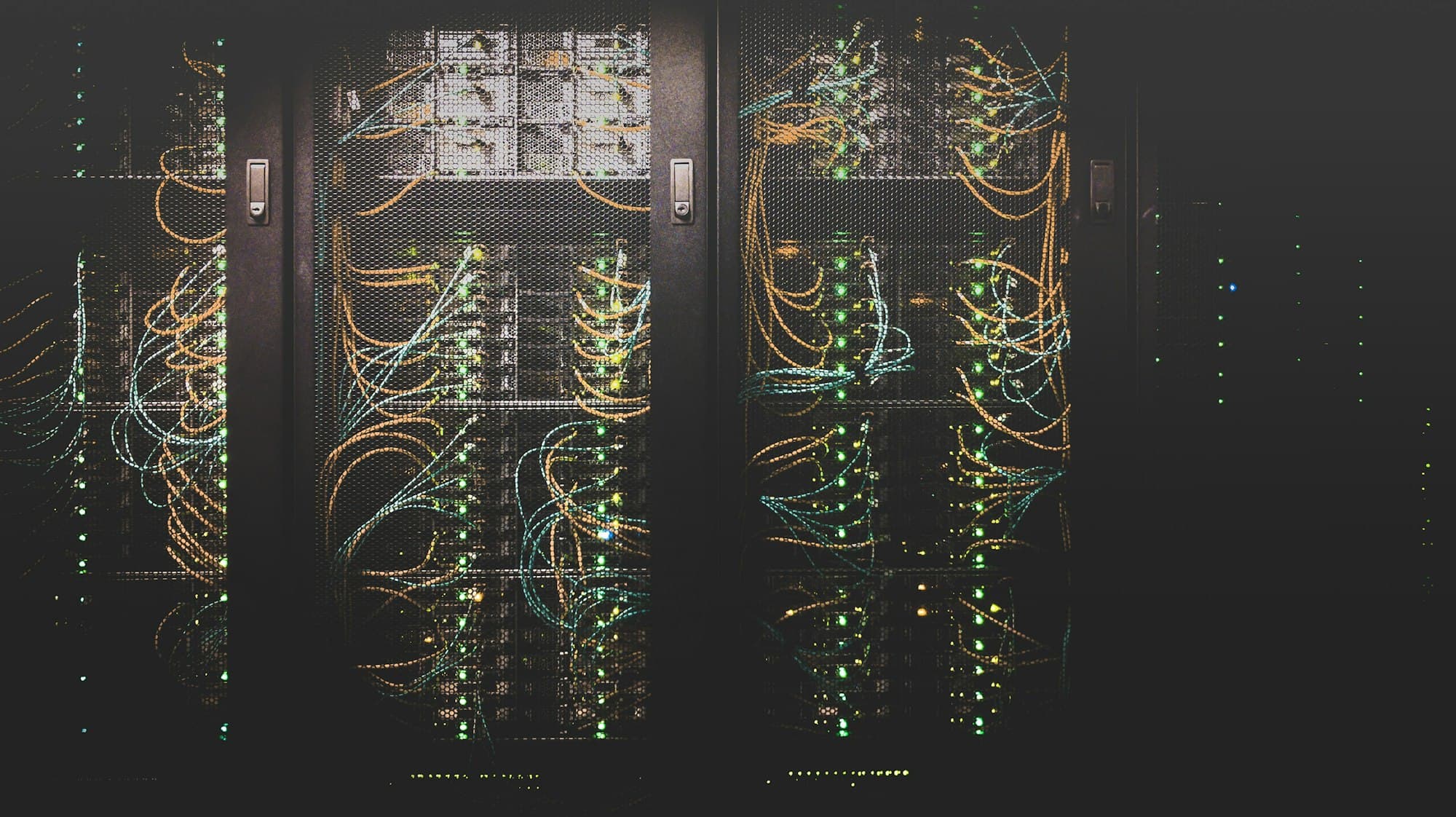Server racks with organized network cabling and status lights