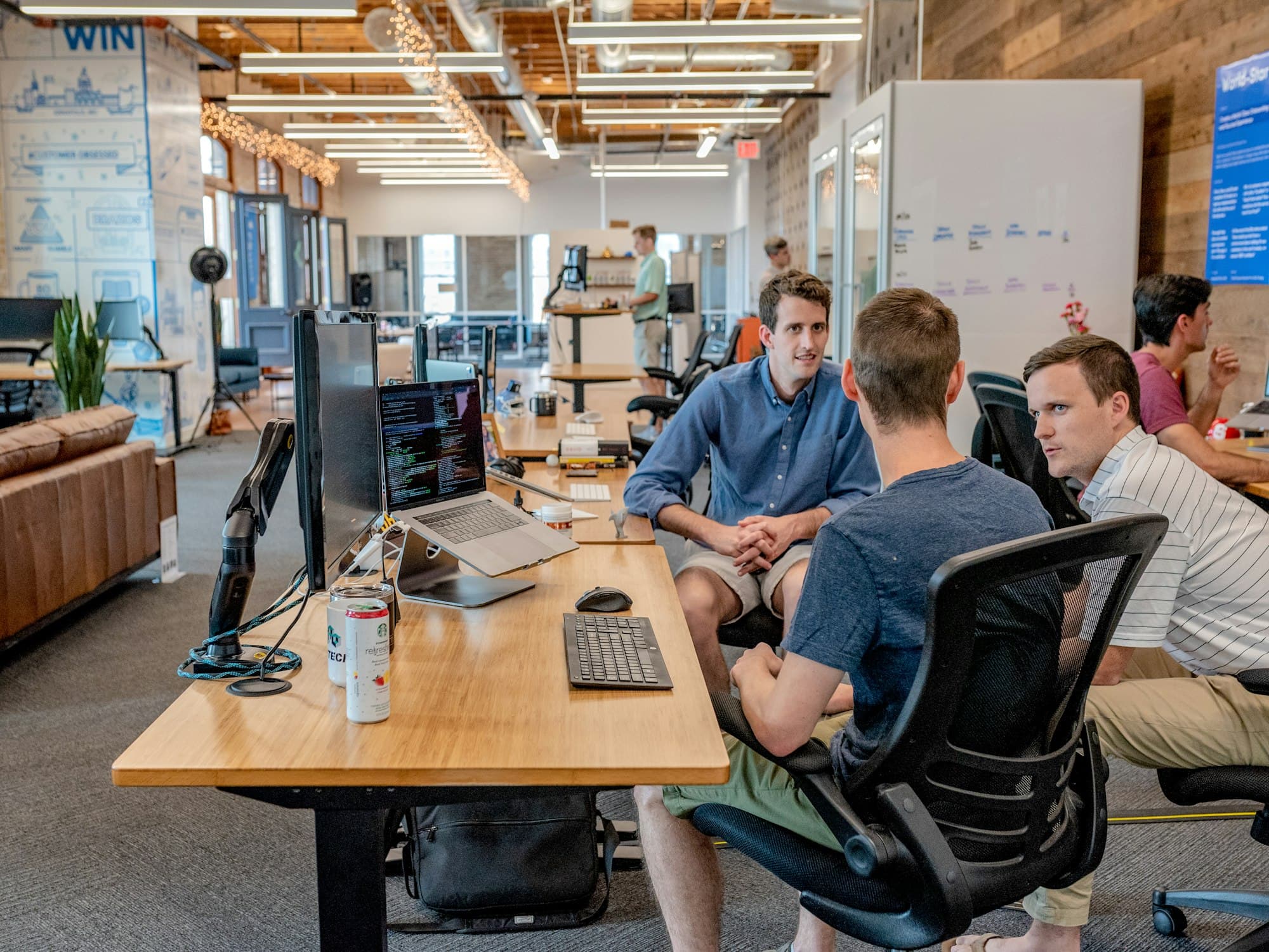 Team working together around desks in an open office